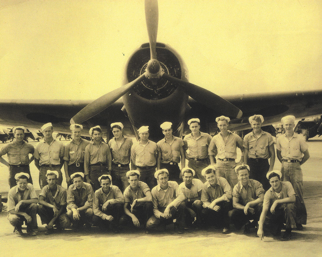 Airmen posing with plane at Brookley Army Air Field
