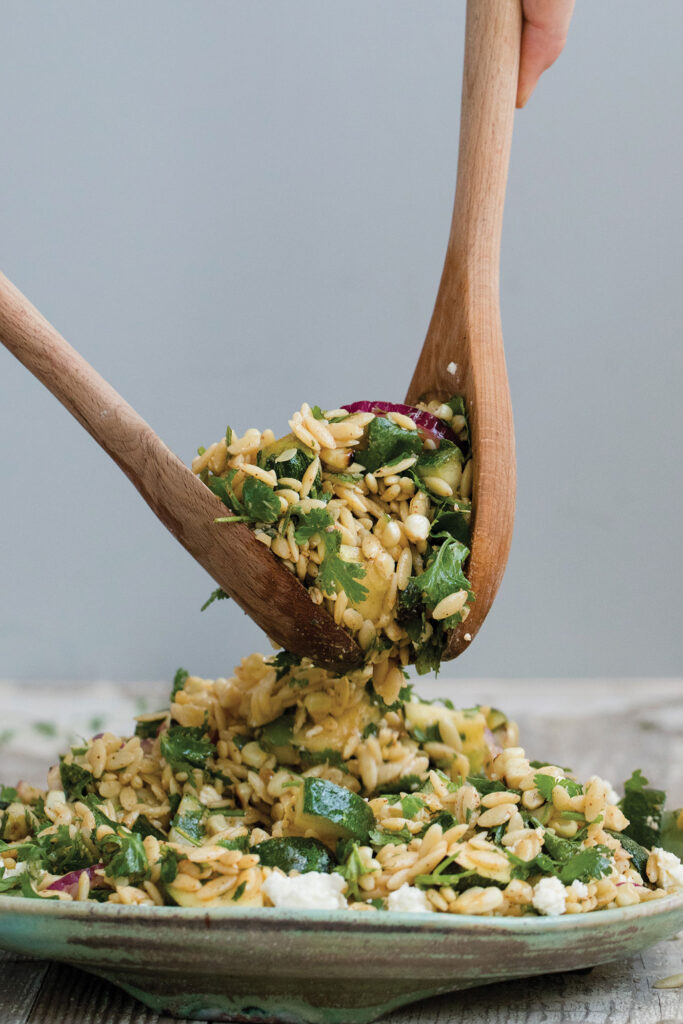 Plate of corn and zucchini orzo