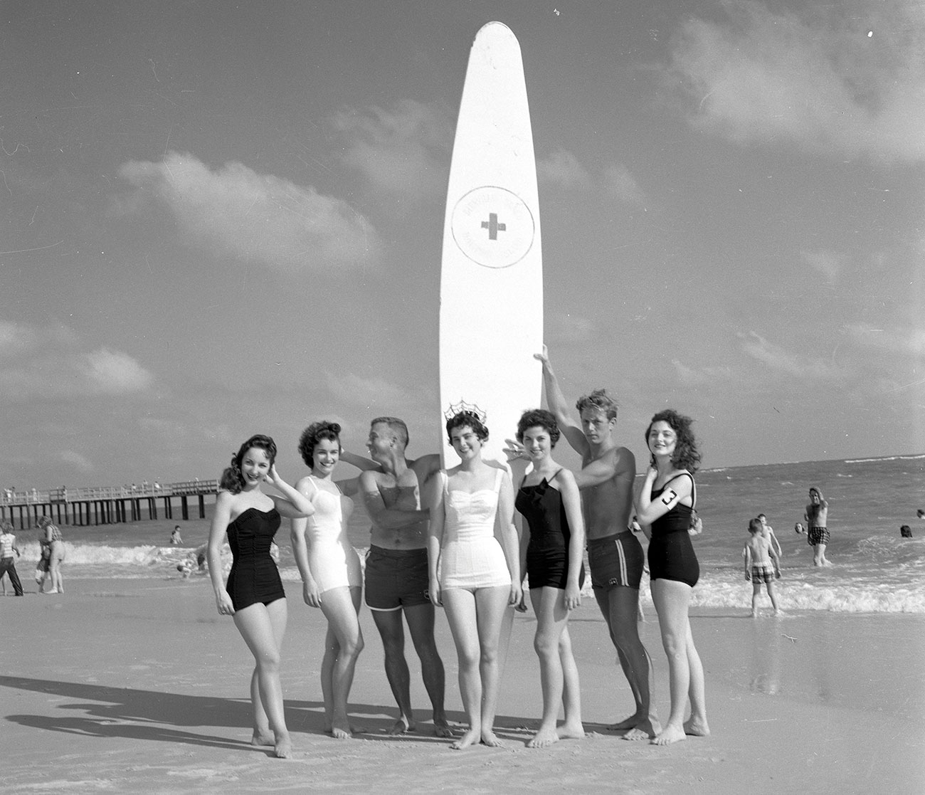 Surfers on the beach at Dauphin Island