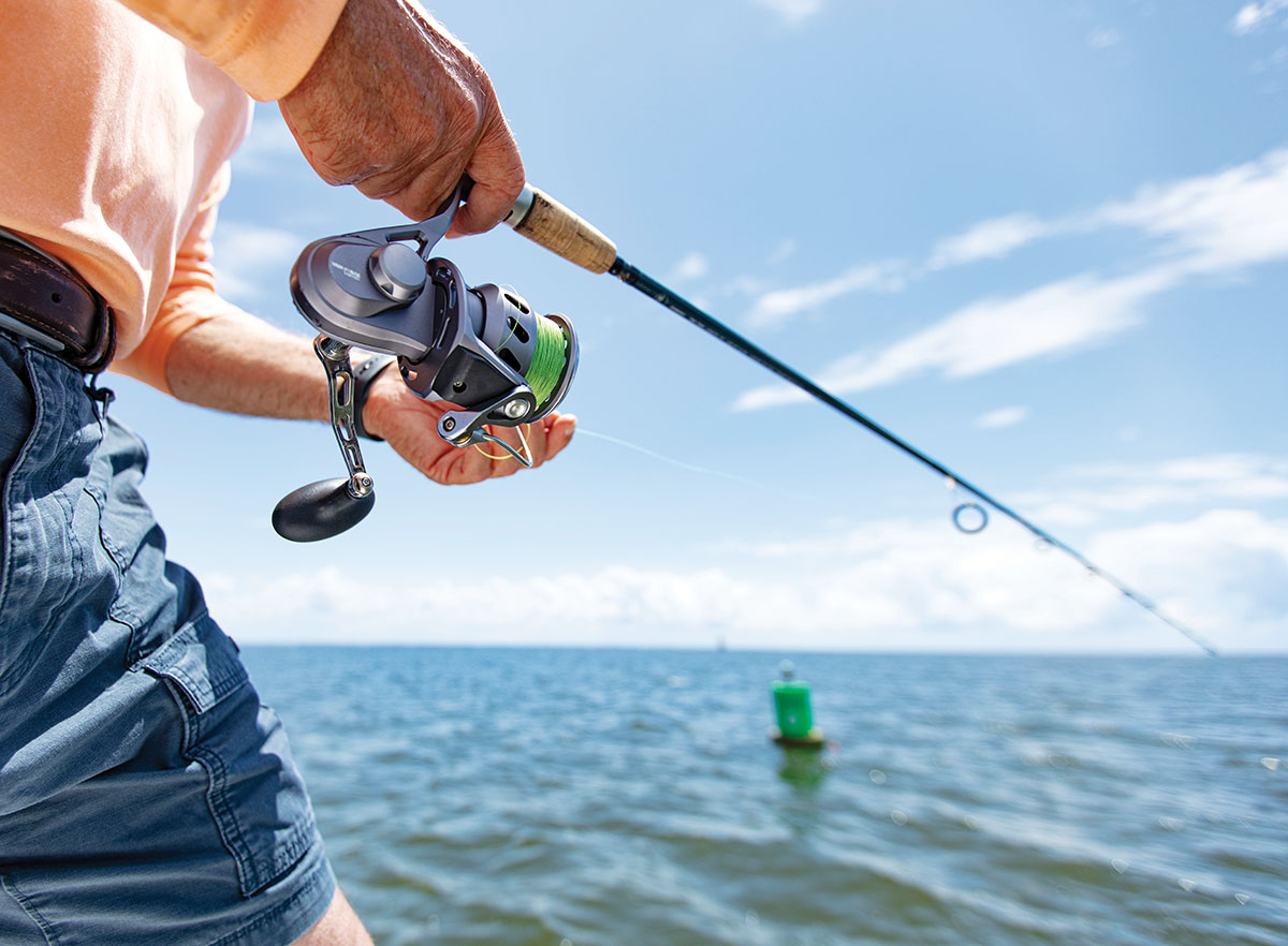 Up close of man fishing for tripletail
